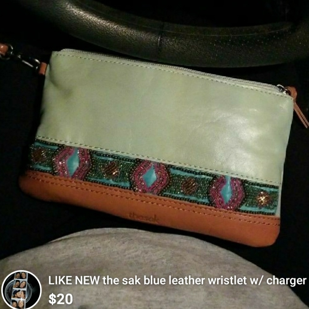 THE SAK WALLET W CHARGER INSIDE